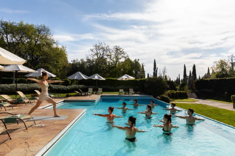 Outdoor pilates session with views of Tuscan hills and cypress trees near San Gimignano - La Collegiata, BZAR hotels in Tuscany